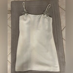 Elegant White Dress with Embellished Straps and Beaded Bow Detail